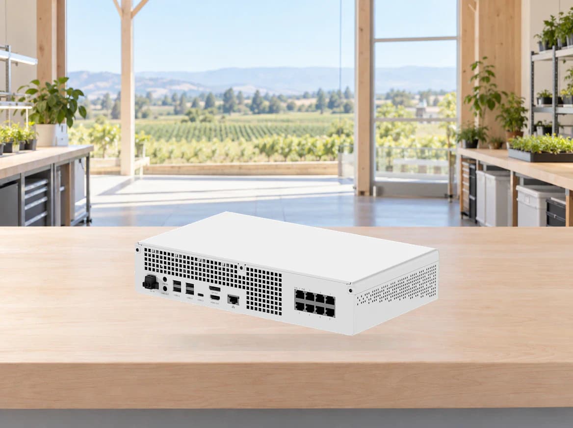 White edge-computing system on a workbench overlooking fields